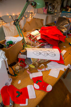 Load image into Gallery viewer, Table with Christmas stockings and decorations in a home setting